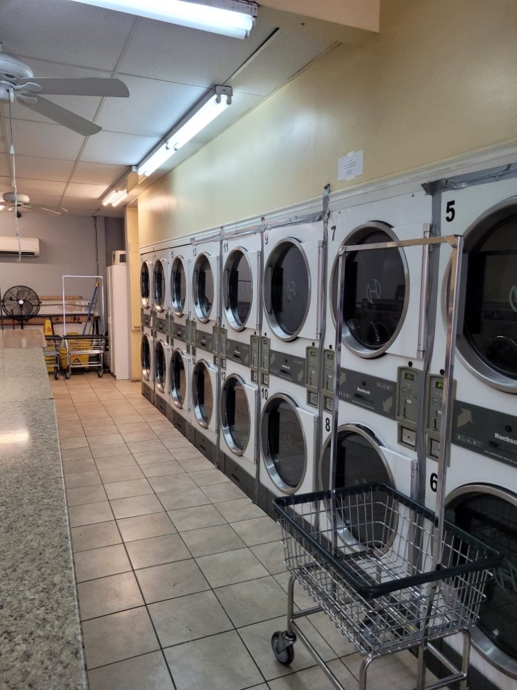 Stacked dryers and folding counter